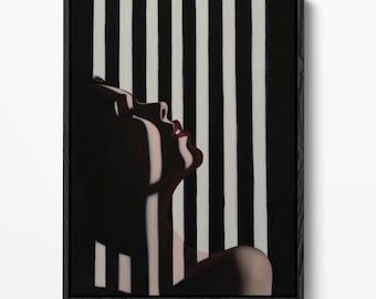 May include: A framed wall art print featuring a side profile of a person with head tilted back, illuminated by light and shadow stripes. The person has dark skin and red lips, set against a background of vertical black and white stripes.