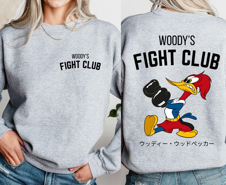a woman wearing a sweatshirt that says woody's fight club