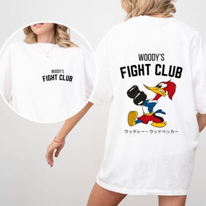 a woman wearing a mickey mouse t - shirt