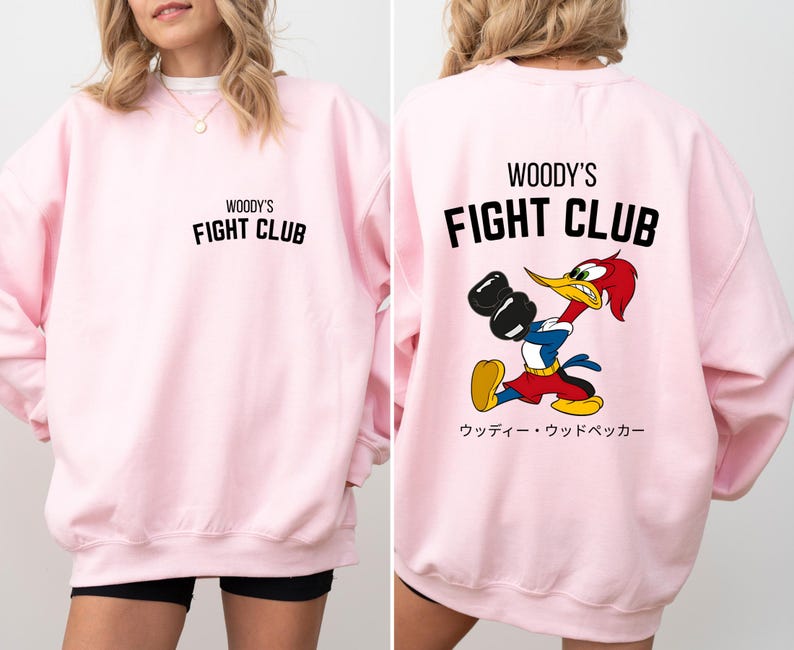 a woman wearing a pink sweatshirt and shorts