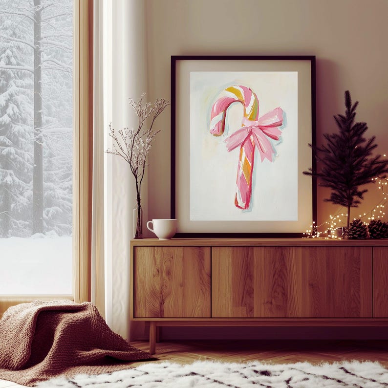 May include: A pink and white striped candy cane with a pink bow, painted in a whimsical style. The candy cane is on a white background.