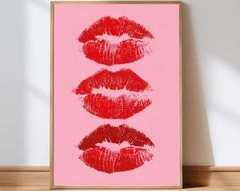 May include: A framed print featuring three red lipstick kiss marks on a pink background. The print is in a wooden frame and includes the text "MELISA'S DREAM Digital Prints" at the bottom.