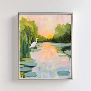 May include: A painting depicting a white egret standing in a pond with lily pads. The water is a soft blue and pink, and the sky is a pale yellow. The egret is facing to the right, and the sun is setting in the background.