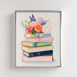 May include: A stack of colorful books with a bouquet of pink, white, and purple flowers on top. The books are arranged in a graduated size, with the largest book on the bottom and the smallest book on top. The flowers are arranged in a loose, natural style.