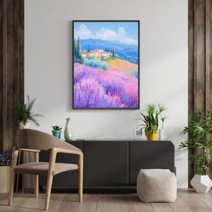 May include: A painting of a lavender field with a small village in the background. The sky is blue with white clouds and the mountains are in the distance.