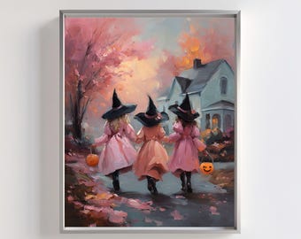 May include: A framed print depicts three young figures in witch costumes, walking hand-in-hand. They wear black hats and pink and peach-colored dresses, carrying jack-o'-lanterns. The background features a house, trees, and a colorful sky, evoking a Halloween theme.