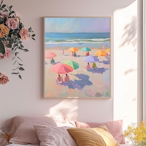 May include: A painting of a beach scene with colorful umbrellas and people relaxing on the sand. The ocean is in the background and the sky is blue.