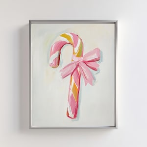 May include: A pink and white striped candy cane with a pink bow tied around it. The candy cane is painted in a whimsical style.