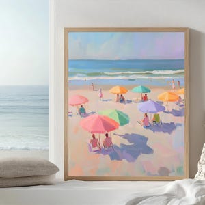 May include: A painting of a beach scene with colorful umbrellas and people relaxing on the sand. The ocean is in the background and the sky is a light blue.