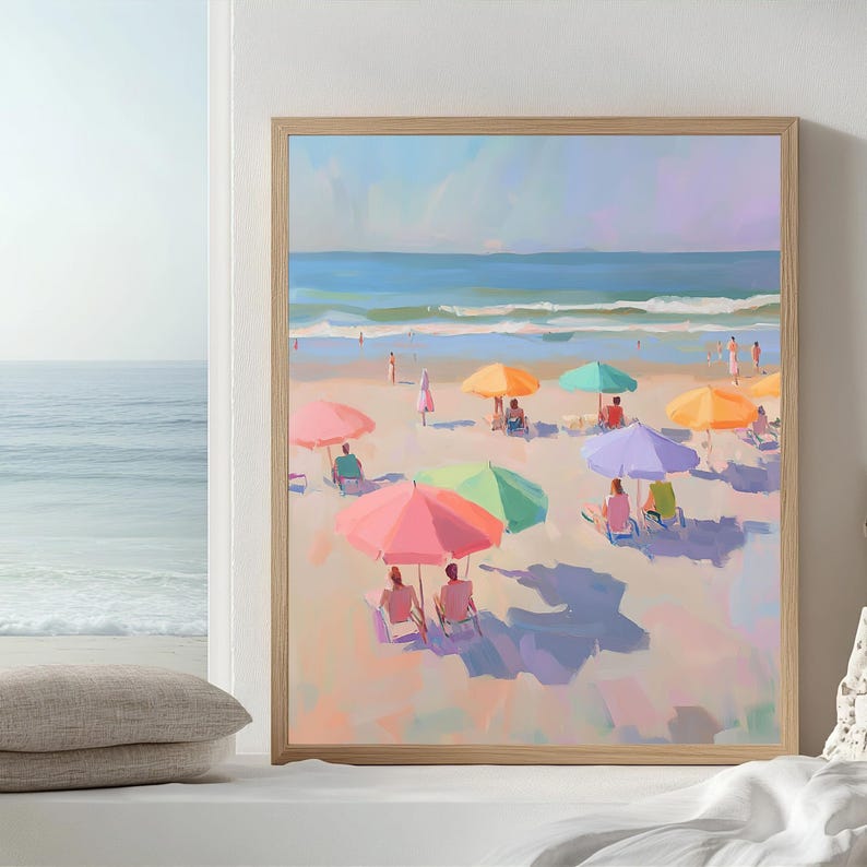 May include: A painting of a beach scene with colorful umbrellas and people relaxing on the sand. The ocean is in the background and the sky is a light blue.