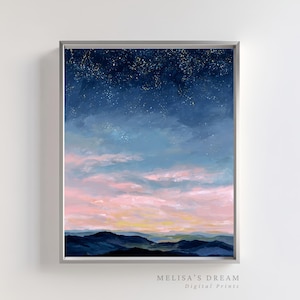 May include: Framed landscape art print depicting a night sky over mountains. The artwork features a gradient of colors, with a dark blue starry sky transitioning to lighter blues and pinks. The mountains are a dark blue, and the print is labeled "MELISA'S DREAM Digital Prints."
