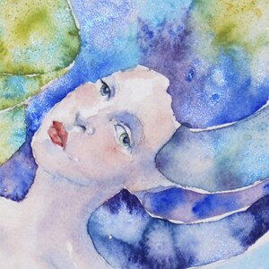 May include: A watercolor painting of a woman's face with blue and purple hair. The woman's eyes are closed and her lips are slightly parted. The background is a soft blue and green.
