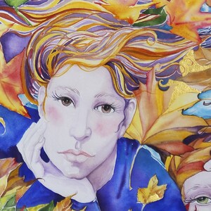 May include: A watercolor painting of a woman with long, flowing blonde hair. She is wearing a blue shirt and is surrounded by autumn leaves in shades of yellow, orange, and red.