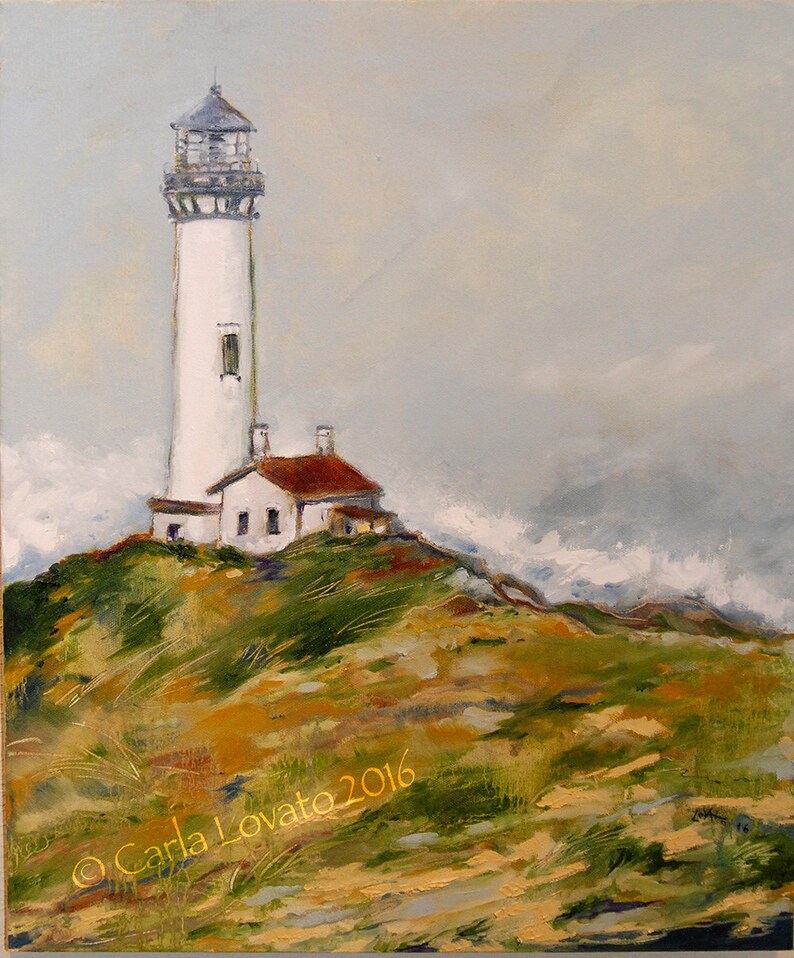 May include: A white lighthouse with a red roof stands on a grassy hilltop against a cloudy sky. The lighthouse has a tall, cylindrical tower with a small, square building attached to the base. The hill is covered in green grass and brown dirt. The sky is a light blue with white clouds.