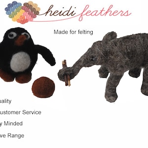 May include: Two felt animal toys, a black and white penguin and a grey elephant, made for felting. The penguin is holding a brown ball. The elephant is holding a stick. The text "Heidi Feathers" and "Made for felting" is visible in the image.