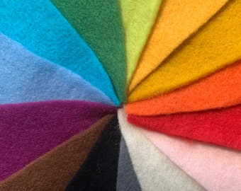 May include: A collection of felt fabric swatches in a rainbow of colors, including teal, light blue, purple, brown, black, gray, white, pink, red, orange, yellow, green, and lime green.