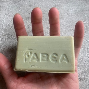 May include: A green bar of soap with the word "ABEA" embossed on it.