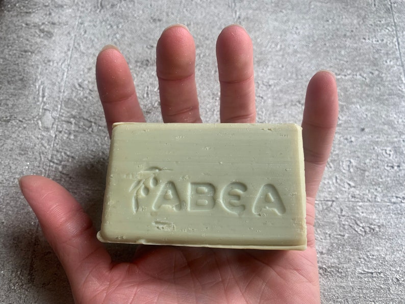 May include: A green bar of soap with the word "ABEA" embossed on it.