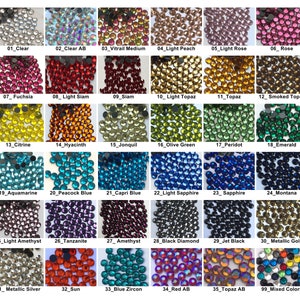 May include: Assortment of 35 different colors of rhinestones, including clear, light peach, light rose, fuchsia, light topaz, and more. The rhinestones are arranged in a grid pattern on a white background.
