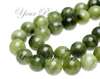 May include: A strand of round, green jade beads. The beads are smooth and polished, with a slight variation in colour.