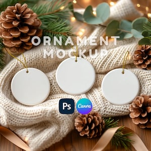 May include: Three blank white circular ceramic ornaments with gold hanging strings. The text "ORNAMENT MOCKUP" is centered above the ornaments, with Photoshop and Canva logos positioned below the center ornament on a textured knit fabric.