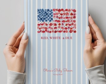 May include: A baby shower guest book with a light blue and white striped cover. The cover features a floral American flag design in red and blue flowers. The text "RED, WHITE & DUE" is above the flag, and "Olivia's Baby Shower" and the date are below.