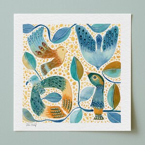 May include: A square art print featuring a watercolor illustration of three birds in shades of blue, teal, and orange. The birds are surrounded by stylized leaves and a background of yellow dots. The artist's signature is visible in the bottom left corner.