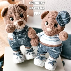 May include: Two crocheted teddy bears wearing denim overalls and a striped shirt. The bears have brown fur and are holding hands. The text "CROCHET PATTERN PDF" is visible in the image.