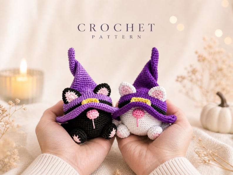 May include: Two crocheted cat figures, one black and one white, each wearing a purple witch hat with a yellow band. The cats have pink noses and ears. The image includes the text "CROCHET PATTERN".