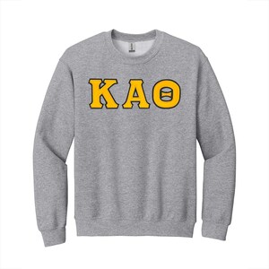 Sudadera de cuello redondo con letras griegas de la hermandad Kappa Alpha Theta