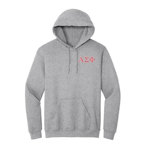 May include: A gray hooded sweatshirt with a front pocket and a drawstring. The Greek letters ΑΣΦ are embroidered in red on the upper chest. The hoodie has a hood and long sleeves.
