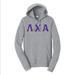 May include: A gray hooded sweatshirt with a kangaroo pocket and drawstring. The Greek letters ΛΧΑ are embroidered in blue with a gold outline across the chest. The sweatshirt is made of a soft, comfortable material.
