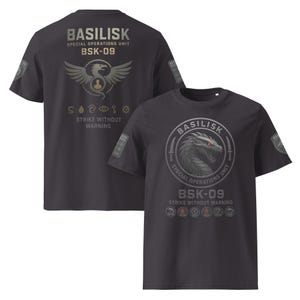 May include: Dark gray t-shirts with the text "BASILISK SPECIAL OPERATIONS UNIT BSK-09 STRIKE WITHOUT WARNING". One shirt features a dragon graphic, the other a winged creature.