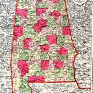 May include: A vintage map of Alabama, showing the state's counties and their borders. The map is color-coded, with each county represented by a different color. The map also includes the state's major cities and towns.