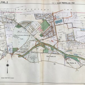 May include: A vintage map of the Main Line, Vol. 2, showing the area of East Whiteland Township, Pennsylvania. The map includes street names, property boundaries, and landmarks, including Philadelphia Memorial Park, the Chester Valley Golf Club, and the Northwest Magnesite Co. The map is printed in black, brown, green, and blue ink on a white background.
