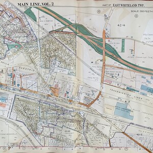 May include: A vintage map of East Whiteland Township, Pennsylvania, showing the layout of streets, buildings, and businesses. The map is titled "Main Line, Vol. 2" and includes the text "Scale: 300 Feet Inch".