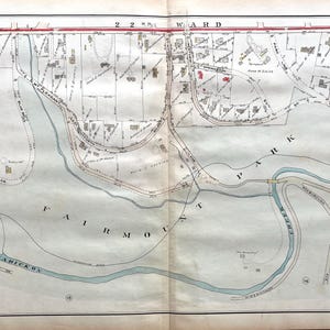 May include: Antique map of the 22nd Ward, featuring Fairmount Park and Wissahickon Creek. The map is detailed with roads, buildings, and the waterway, rendered in muted tones of blue, brown, and beige. The map is aged and shows signs of wear.