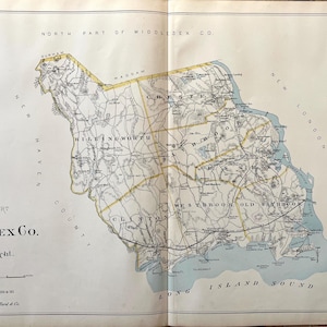 May include: Antique map of Middlesex County, Connecticut, with detailed roads, towns, and geographical features. The map is divided into north and south parts, with text labels and a scale bar. The Long Island Sound is visible.