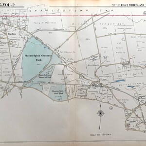 May include: A black and white map of a section of East Whiteland Township, Pennsylvania. The map shows roads, streets, and property lines. The map also includes the location of Philadelphia Memorial Park, a large park with a lake.