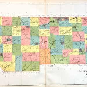 May include: A vintage map of Potter and Tioga Counties, Pennsylvania, with a grid pattern and color-coded townships. The map shows rivers, roads, and railroads. The title "Potter and Tioga Counties" is printed at the bottom of the map.