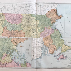 May include: A vintage map of Massachusetts, showing the state's counties and major cities. The map is printed in a light blue, green, and pink color scheme. The map is titled "Rand McNally & Company's Indexed Atlas of the World" and is dated 1895.