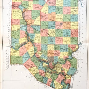 May include: A vintage map of Lawrence, Butler, Beaver, and Allegheny counties in Pennsylvania. The map is divided into squares, each representing a different township. The map is printed in shades of green, yellow, pink, and blue. The map includes the text "Lawrence Butler Beaver and Allegheny Counties".