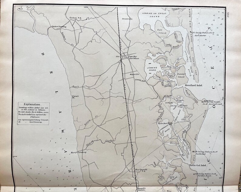 May include: A vintage map with detailed line drawings of a coastal region, featuring inlets, islands, and place names. The map is in grayscale, with text labels and a key in the lower left corner. The paper has a slightly aged appearance.