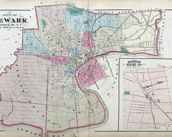 May include: A vintage map of Newark, New Jersey, showing the city's streets and neighborhoods. The map is divided into sections, each with a different color. The map also includes a key that identifies the different sections.