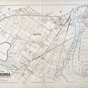 May include: A vintage map of Philadelphia, Pennsylvania, showing the city's layout and streets. The map is divided into two sections, with the Schuylkill River running through the center. The map is labeled "Part of Wards 26 & 27" and "Plate 5."