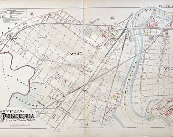 May include: A vintage map of Philadelphia, Pennsylvania, showing the city's layout and streets. The map is divided into two sections, with the Schuylkill River running through the center. The map is labeled "Part of Wards 26 & 27" and "Plate 5."