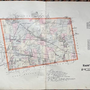 May include: Antique map of East Whiteland, featuring detailed roads, buildings, and property lines. The map is framed with an orange border and includes text such as "Field Offices" and "References." The map is on aged paper, with handwritten notes and signatures.