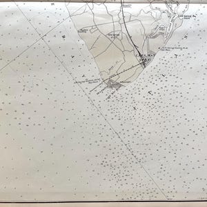 May include: Vintage nautical chart of Cape May, New Jersey, featuring detailed coastlines, water depths, and navigational markers. The map is printed in black ink on aged paper, with the title "Cape May" visible. The chart includes place names and grid lines.