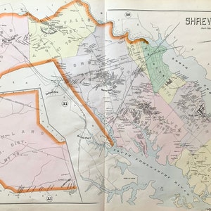 May include: A vintage map of Shrewsbury, Massachusetts, showing the different school districts and roads. The map is printed in black and white with colored lines and text. The map is titled "Shrewsbury" and includes a scale bar and compass.
