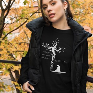 May include: Black t-shirt with a white graphic of a tree with roots forming a cross. The text "when you were under the fig tree, I saw you." and "John 1:48" are printed below the graphic.